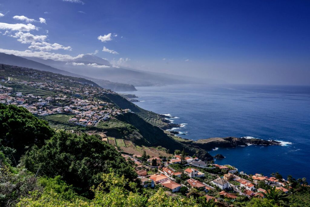 Breathtaking aerial view of El Sauzal coastline with scenic hills and clear skies in Tenerife.