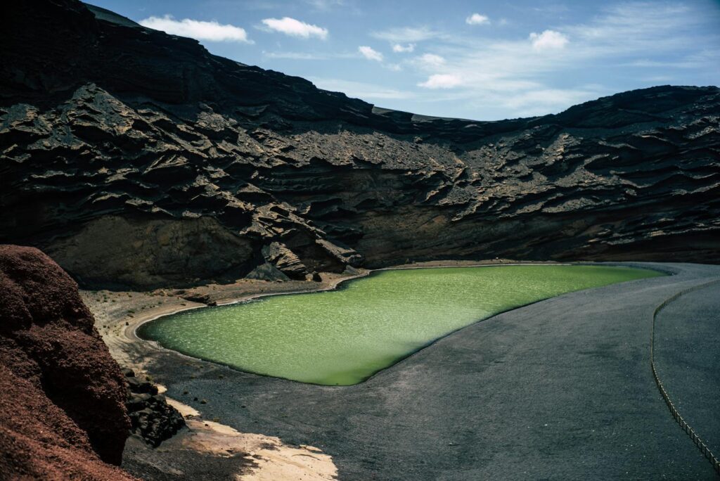 A breathtaking view of the Green Lagoon in the volcanic landscape of Lanzarote, Spain.