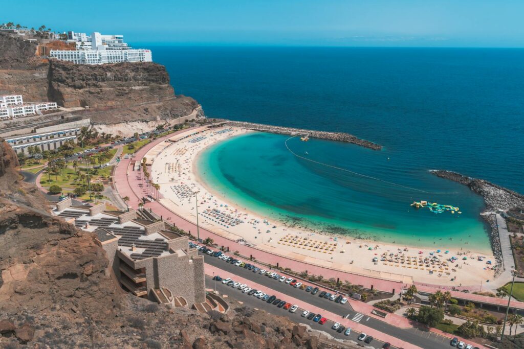 Stunning aerial view of Playa de Amadores beach with turquoise sea in Gran Canaria, Spain.