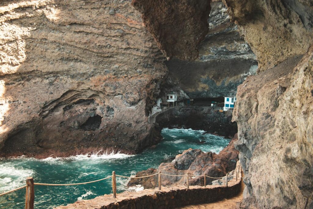 Explore the enchanting Poris de Candelaria cave with stunning coastal views in La Palma, Spain.