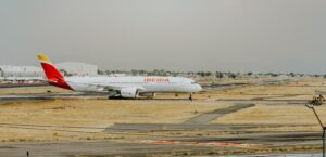 Iberia airplane on runway at airport, ready for international travel.