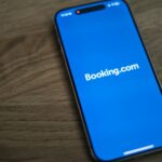A blue samsung phone with the logo of bookking com on it